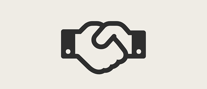 Black handshake icon representing teamwork, collaboration, or partnership.