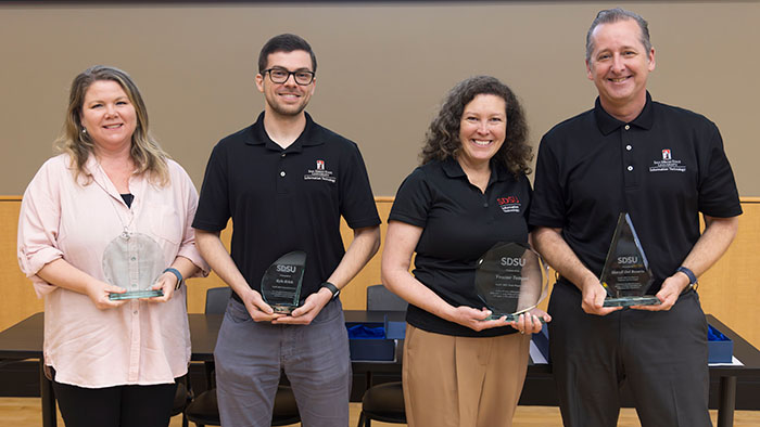 OneIT awardees: Layna Pena-Buskirk, Kevin Krick, Yvonne Tempel, and Chris Clements on behalf of Sheryll Del Rosario