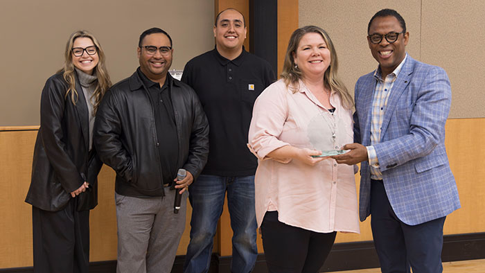 OneIT Diversity Ally Awardee Layna Pena-Buskirk with OneIT Awards Committee members Ed Legaspi, Kevin Perez, Kirk Campbell, and Tayor Jaress.