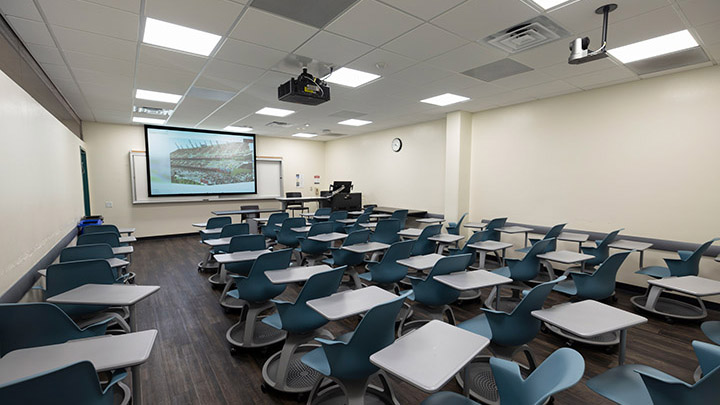 classroom with projection screen in background