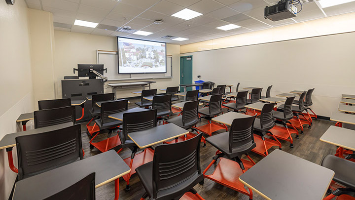 classroom with projection screen in background