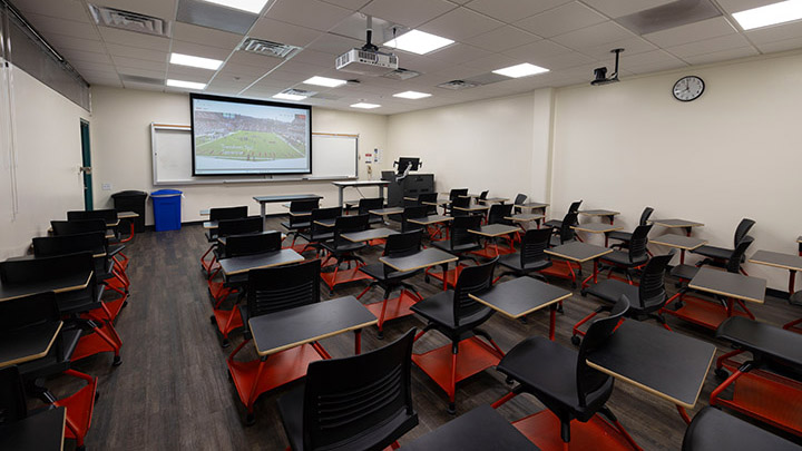 classroom layout with projection screen in background