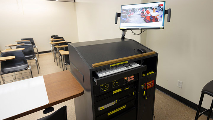 Adams Humanities 2116's instructor podium with integrated tech