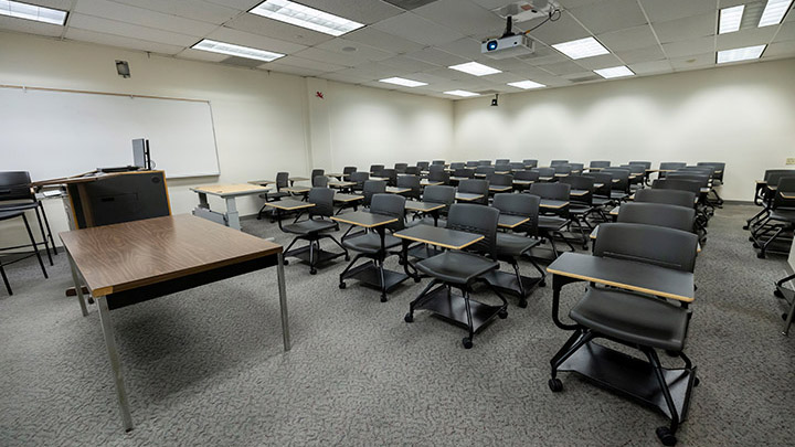 Adams Humanities 3110 view from front showing the podium and projector