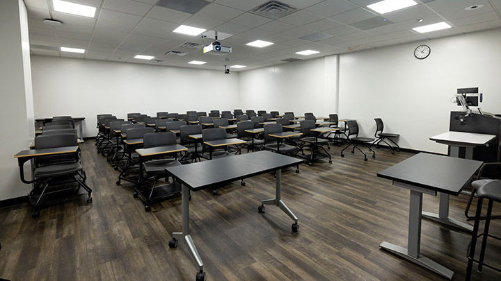 Adams Humanities 3113 view from front showing the podium and projector