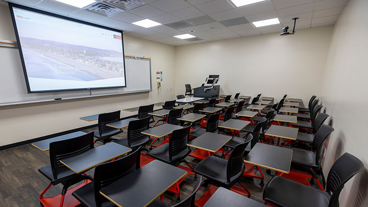 Adams Humanities 3130 view from back showing the podium and projection screen