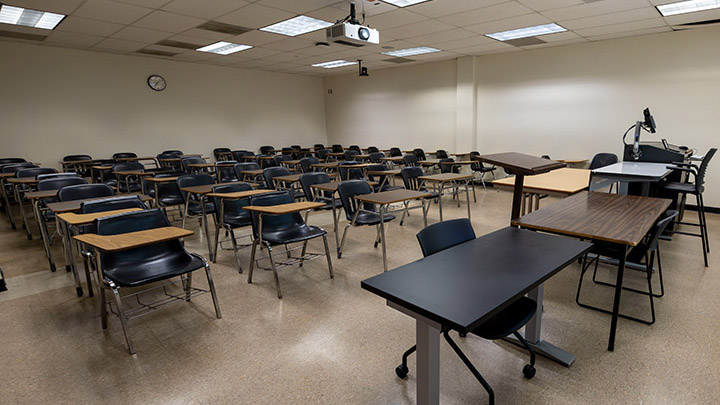 Adams Humanities 3177 view from front showing the podium and projector