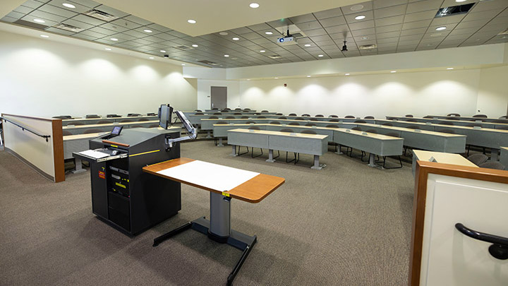 Arts and Letters 101 view from front showing the podium and projector