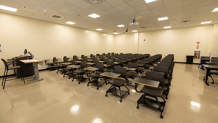 Front of classroom showing the podium and projector