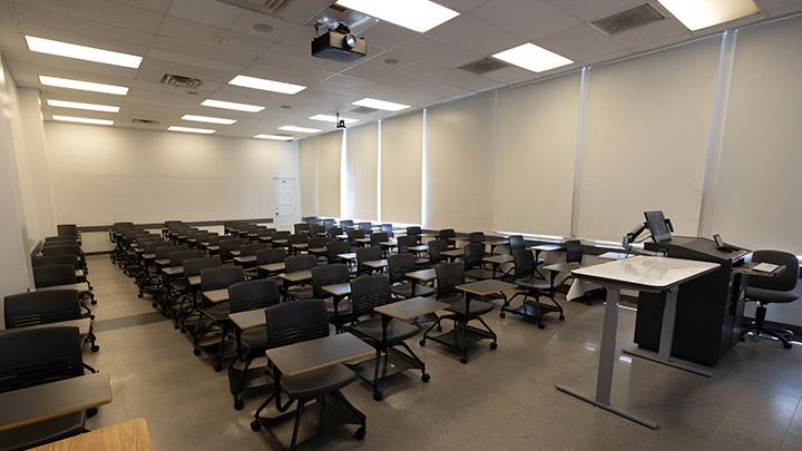 Front of classroom showing the podium and projector