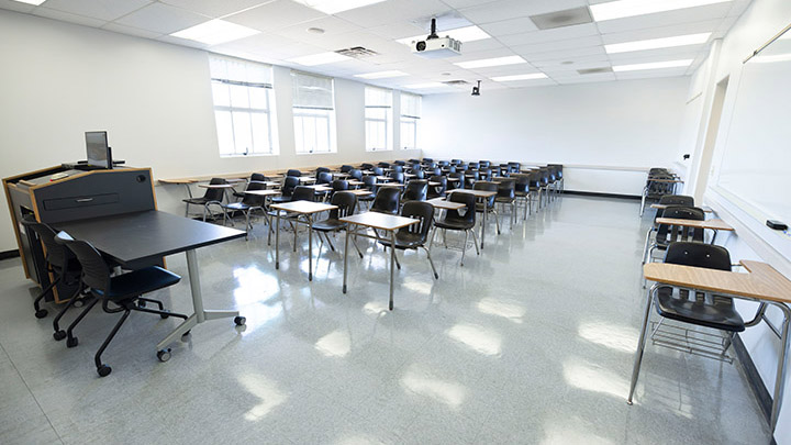 Front of classroom showing the podium and projector