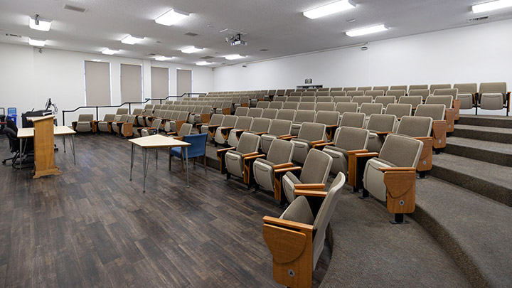 Front of classroom showing the podium and projector