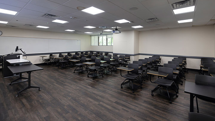 Front of classroom showing the podium and projector