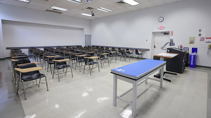 Front of classroom showing the podium and projector