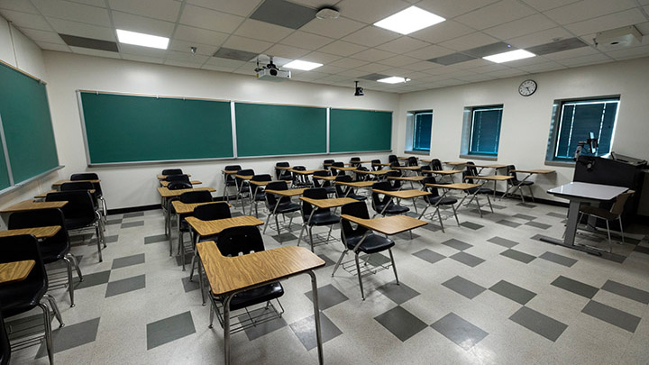 Front of classroom showing the podium and projector