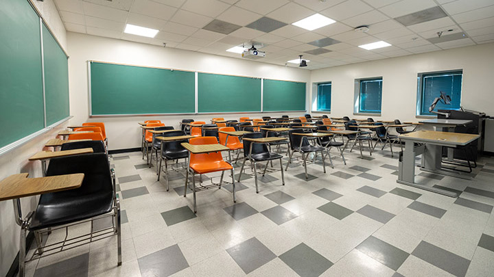 Front of classroom showing the podium and projector