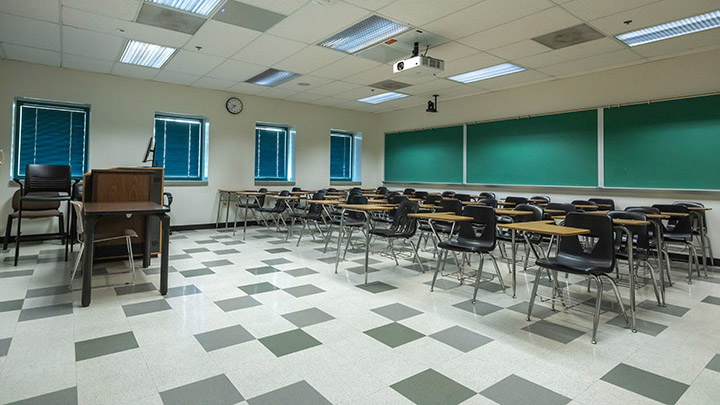 Front of classroom showing the podium and projector