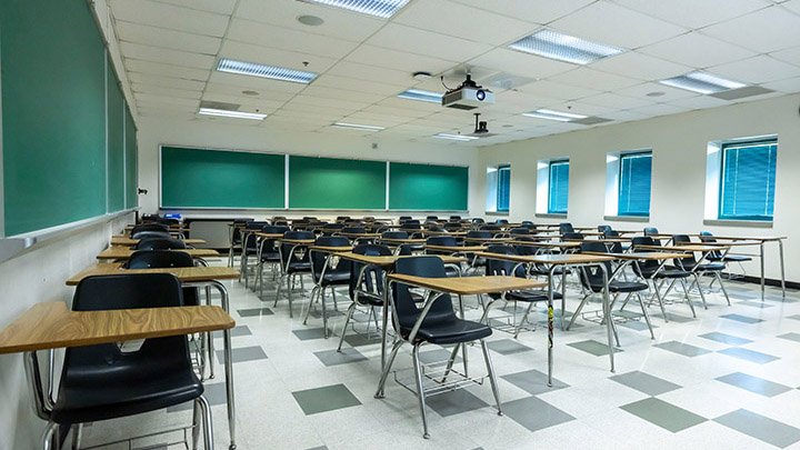 Front of classroom showing the podium and projector