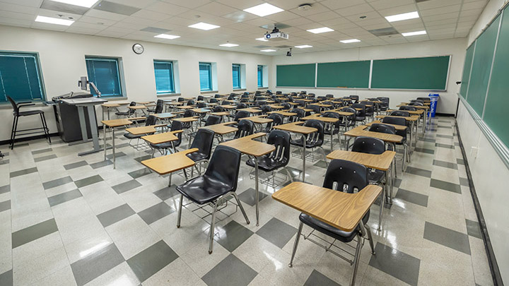 Front of classroom showing the podium and projector