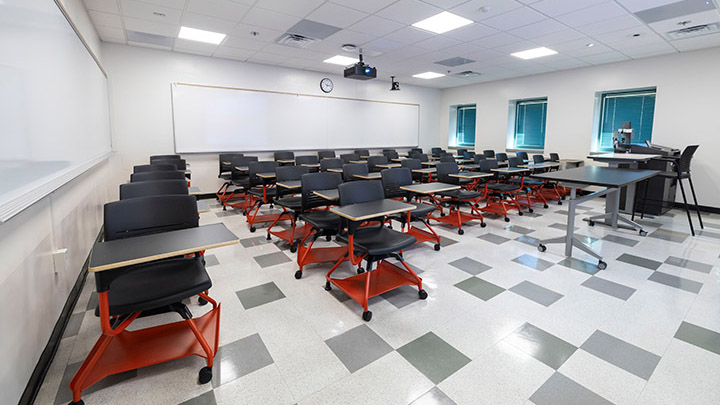 Front of classroom showing the podium and projector