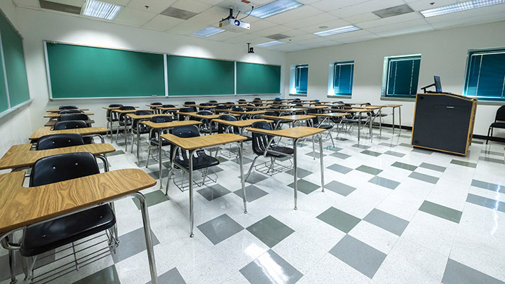 Front of classroom showing the podium and projector