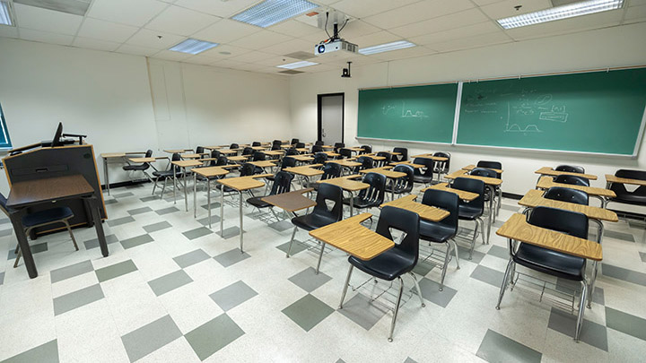 Front of classroom showing the podium and projector