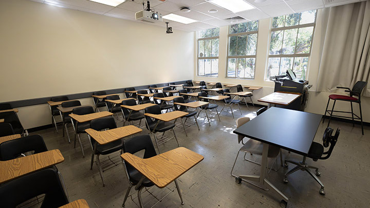 Front of classroom showing the podium and projector