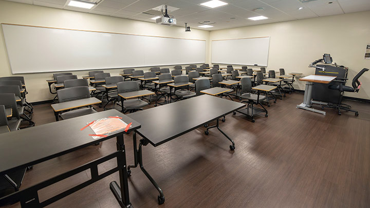 Front of classroom showing the podium and projector