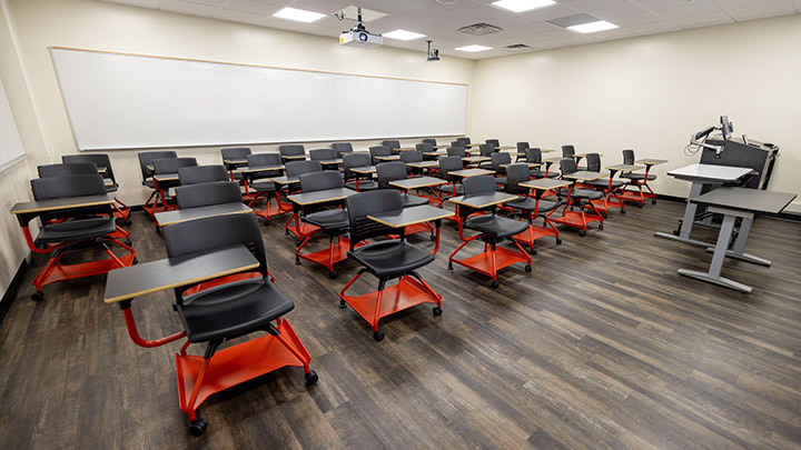 Front of classroom showing the podium and projector