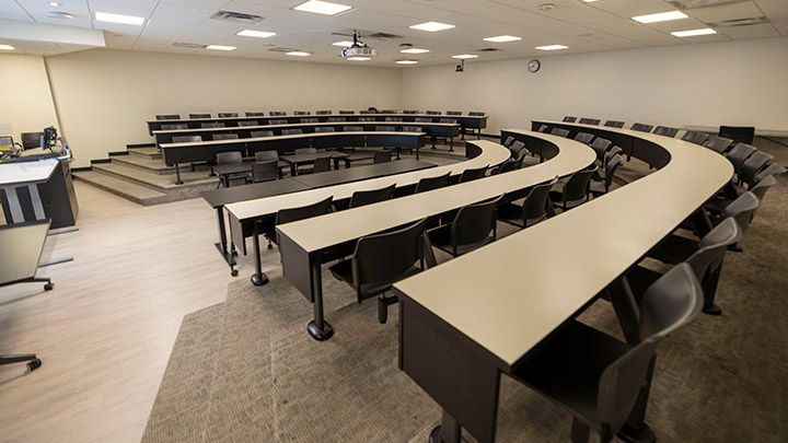 Front of classroom showing the podium and projector