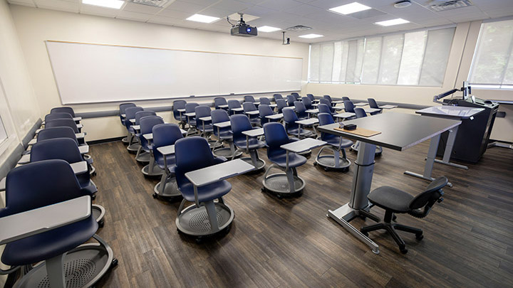 Front of classroom showing the podium and projector