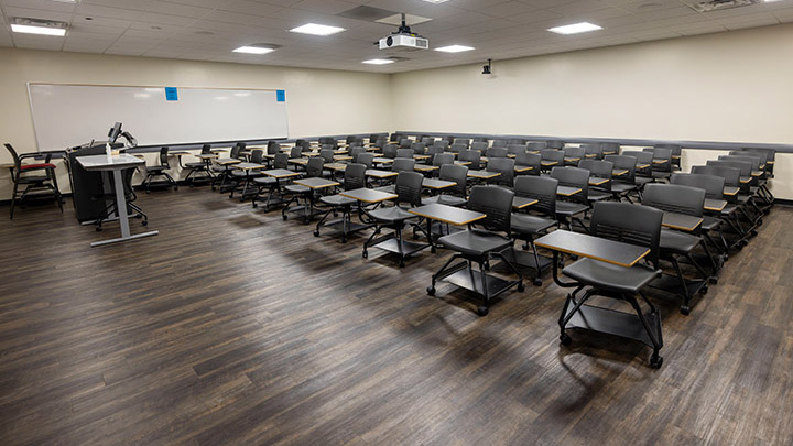 Front of classroom showing the podium and projector