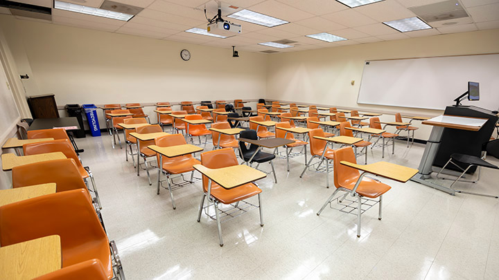 Front of classroom showing the podium and projector