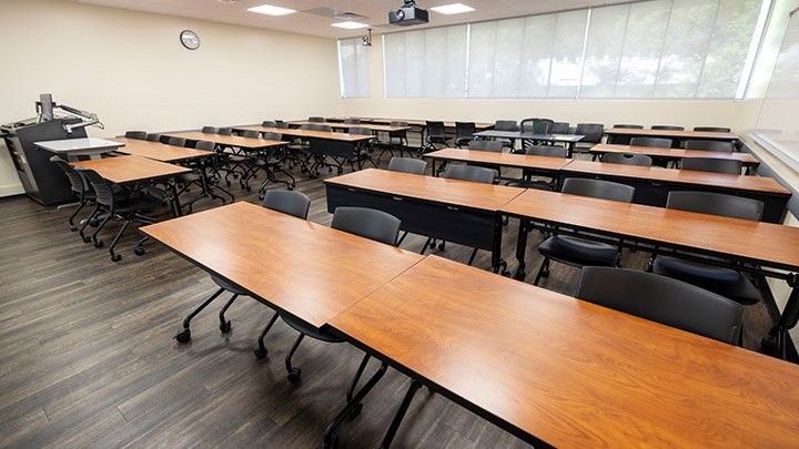 Front of classroom showing the podium and projector