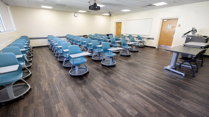 Front of classroom showing the podium and projector