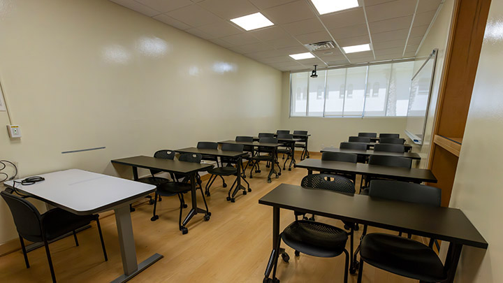 Front of classroom showing the podium and projector