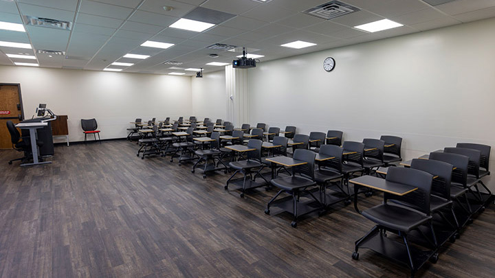 Front of classroom showing the podium and projector