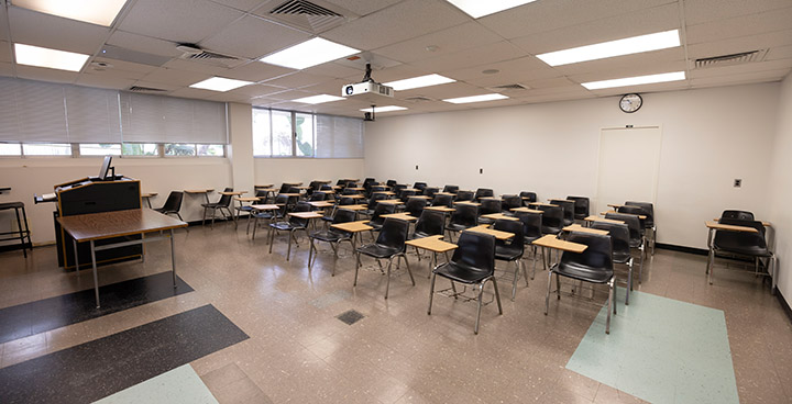 Front of classroom showing the podium and projector