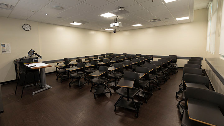 Front of classroom showing the podium and projector