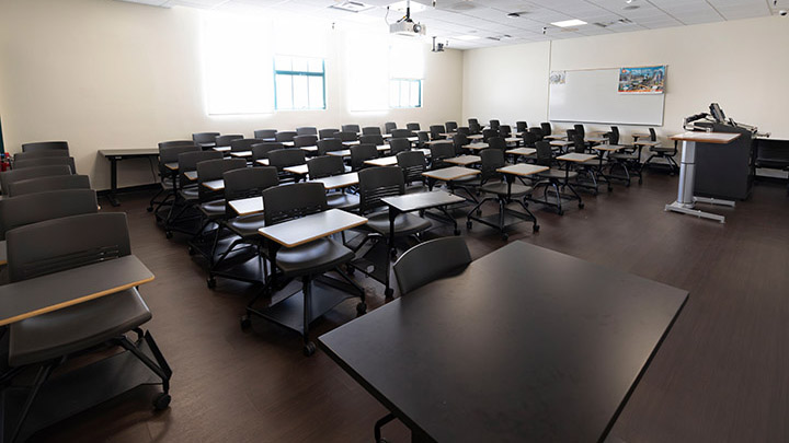 Front of classroom showing the podium and projector