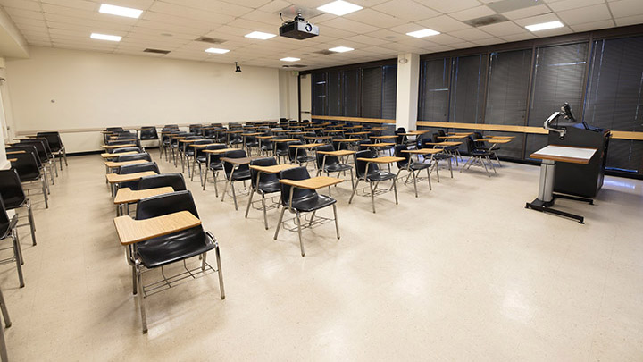 Front of classroom showing the podium and projector