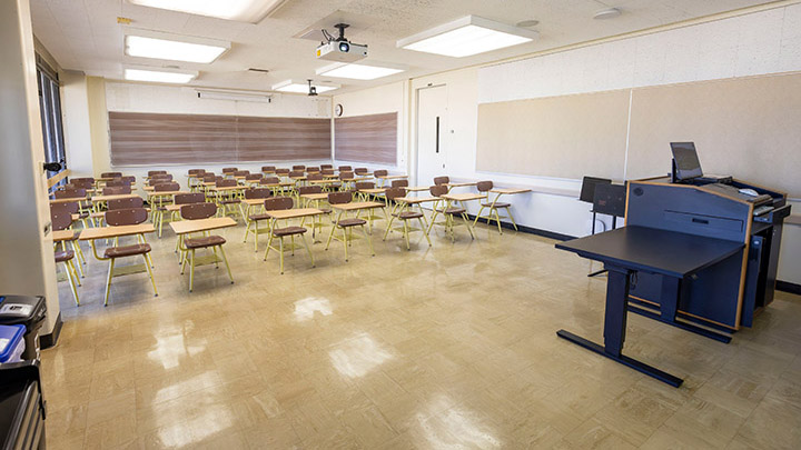 Front of classroom showing the podium and projector