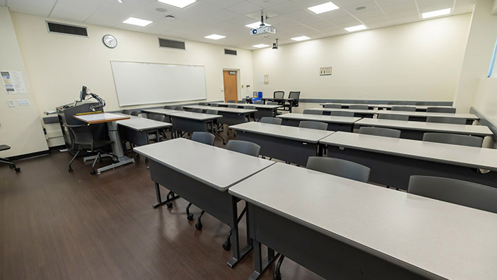 Front of classroom showing the podium and projector