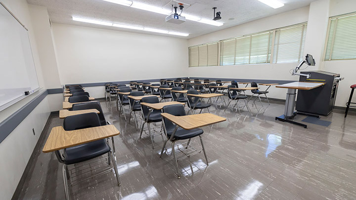 Front of classroom showing the podium and projector