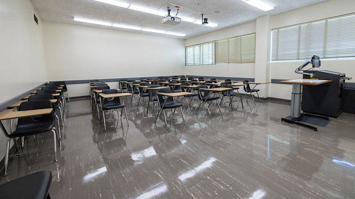 Front of classroom showing the podium and projector