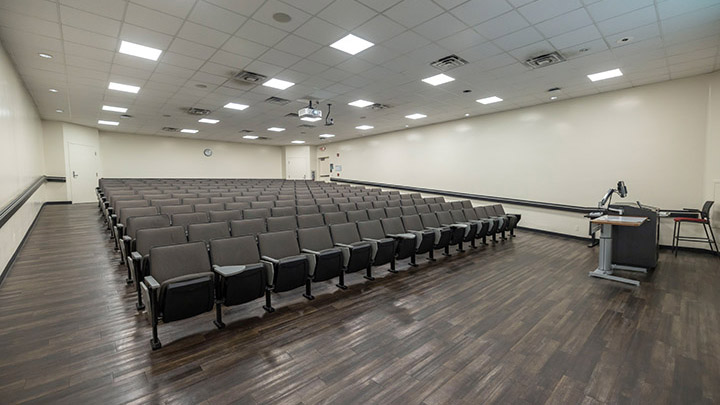 Front of classroom showing the podium and projector