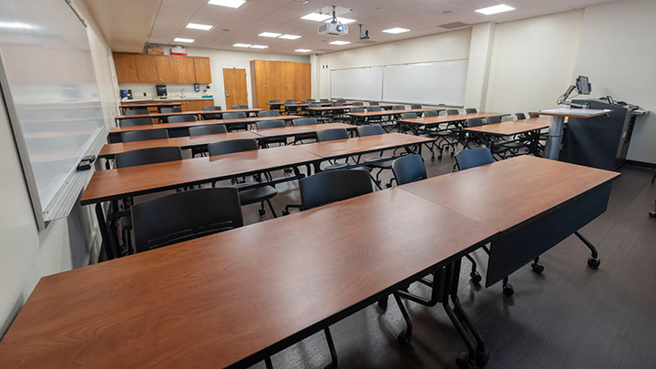 Front of classroom showing the podium and projector