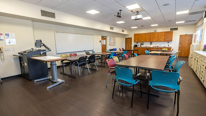 Front of classroom showing the podium and projector