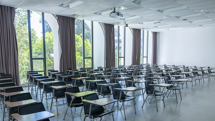 Front of classroom showing the podium and projector