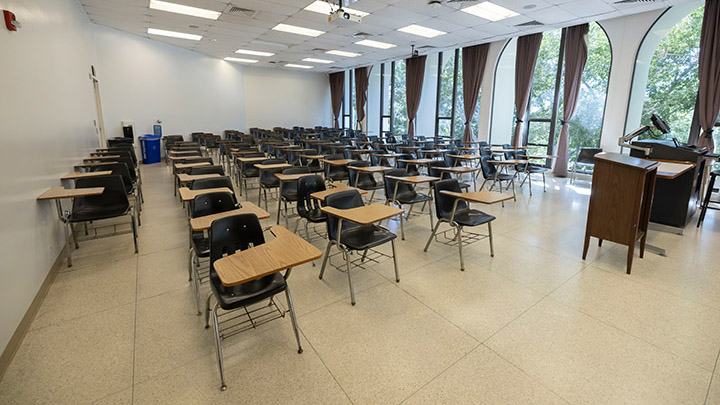 Front of classroom showing the podium and projector